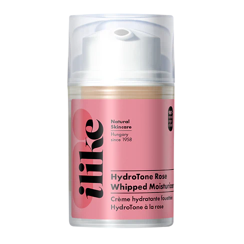 HydroTone Rose Whipped Moisturizer in a soft pink cream texture, shown in an elegant white jar with rose accents, highlighting its lightweight, hydrating formula for radiant skin